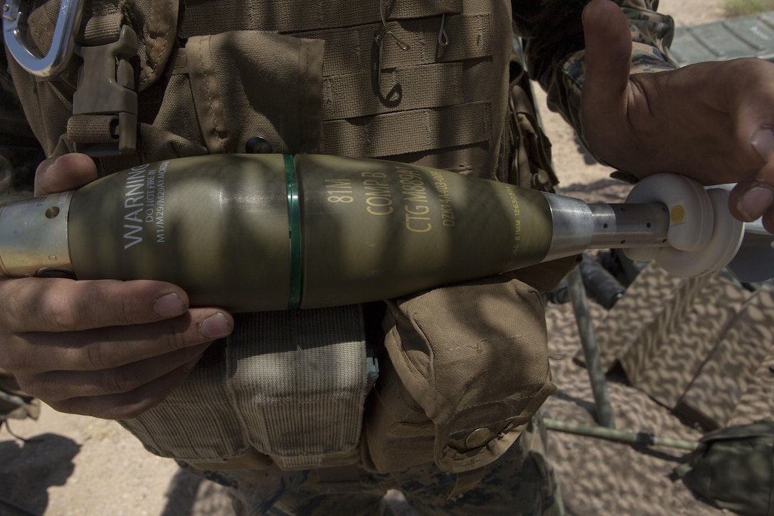 A U.S. Marine with Weapons Company, 2nd Battalion, 24th Marine Regiment, 4th Marine Division, Marine Forces Reserve, holds a 60mm light mortar missile during Fire Support Coordination Exercise, a training event during Integrated Training Exercise 4-17 at Marine Corps Air Ground Combat Center, Twentynine Palms, California on June 26th, 2017. ITX allows Reserve Marines to train in realistic environments under realistic conditions, ensuring Marines maintain the highest level of proficiency and readiness for worldwide deployment. (U.S. Marine Corps photo by Lance Cpl. Imari J. Dubose/Released)