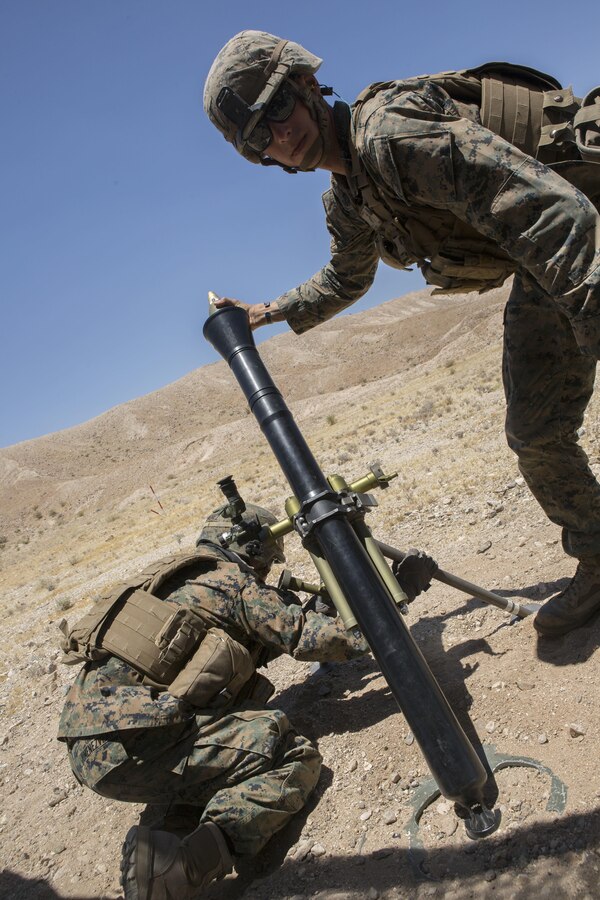 U.S. Marine Corps Lance Cpl. Carlos Jimenez, left, and Cpl. Gerry Potempa, motarmen with Weapons Company, 2nd Battalion, 24th Marine Regiment, 4th Marine Division, Marine Forces Reserve, conduct fire support with the 60mm light mortar during the Fire Support Coordination Exercise, a training event during Integrated Training Exercise 4-17 Marine Corps Air Ground Combat Center, Twentynine Palms, California on June 26th, 2017.  ITX 4-17 focused on the practical application of combined-arms maneuver warfare in preparation to support the active component across a range of military operations. (U.S. Marine Corps photo by Lance Cpl. Imari J. Dubose/Released)
