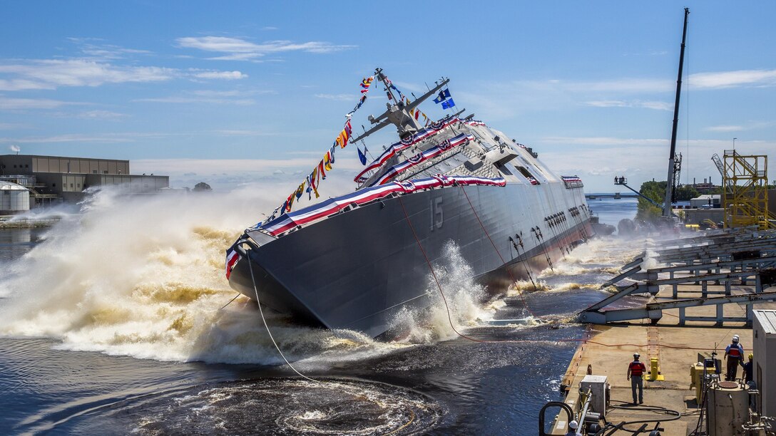 The Navy’s future USS Billings launches sideways into the Menominee River in Marinette, Wis., July 1, 2017, following its christening, Once commissioned, the Billings, which honors Montana's largest city, will be the first ship of its name in naval service. Navy photo courtesy of Lockheed Martin

