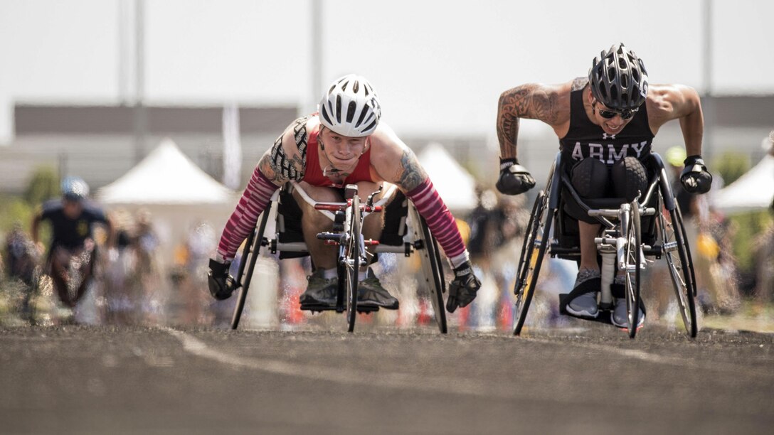 Marine Corps Cpl. Dakota Q. Boyer, left, and Army veteran Jhoonar Barrera compete in a wheelchair racing event during the 2017 Department of Defense Warrior Games in Chicago, July 2, 2017. The Warrior Games are an annual event allowing wounded, ill and injured service members and veterans to compete in Paralympic-style sports. DoD photo by Roger L. Wollenberg