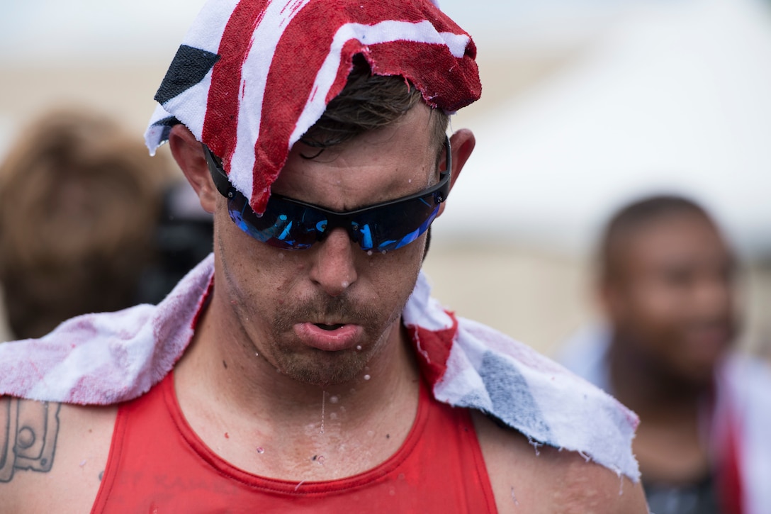 Marine Corps Sgt. Mike Nicholson cools off after competing in a track event during the 2017 Department of Defense Warrior Games at Lane Technical College Preparatory High School in Chicago, July 2, 2017. DoD photo by Roger L. Wollenberg