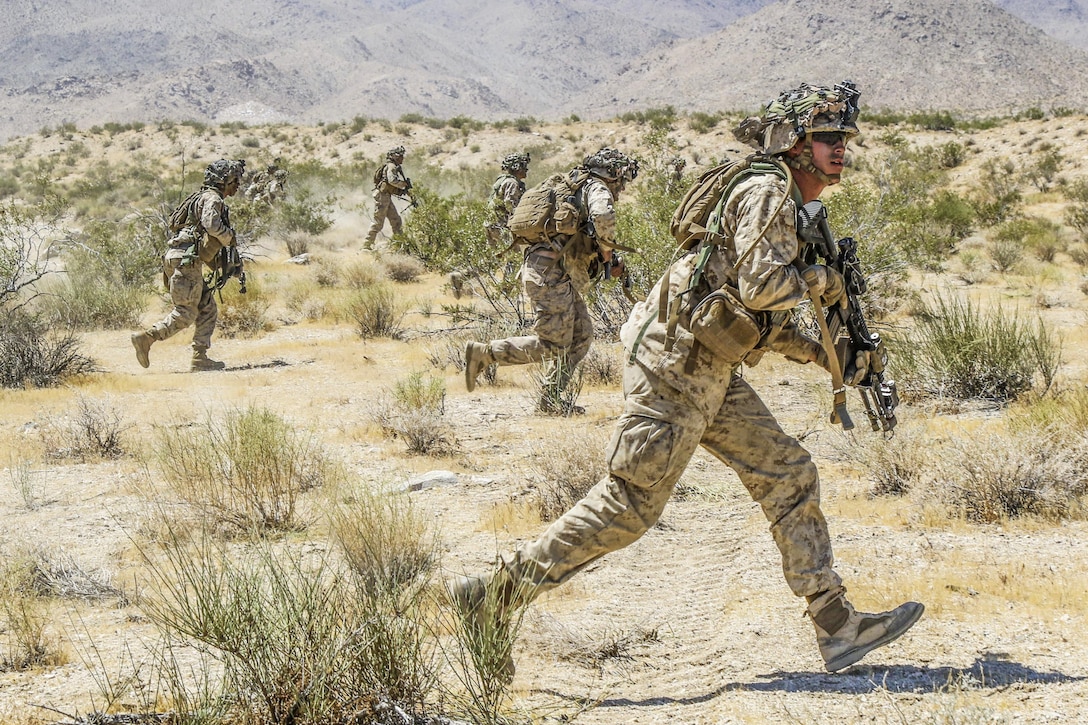 Marines move to conduct a simulated assault outside the Alpine Pass at the National Training Center at Fort Irwin, Calif., June 30, 2017. The Marines are assigned to Echo Company, 2nd Battalion, 4th Infantry Regiment. Army photo by Pfc. Austin Anyzeski