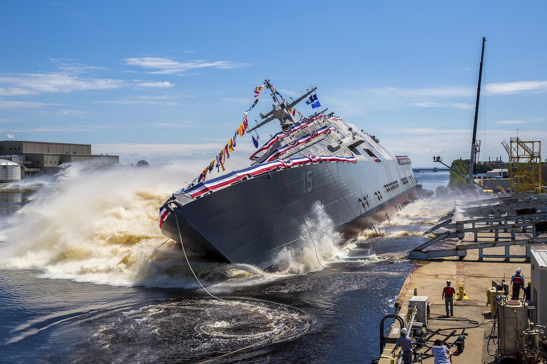 The Navy’s future USS Billings launches sideways into the Menominee River in Marinette, Wis., July 1, 2017, following its christening, Once commissioned, the Billings, which honors Montana's largest city, will be the first ship of its name in naval service. Navy photo courtesy of Lockheed Martin
