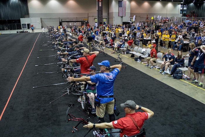 A line of archers compete in the 2017 Department of Defense Warrior Games archery competition in Chicago, July 3, 2017. The Warrior Games are an annual event allowing wounded, ill and injured service members and veterans to compete in Paralympic-style sports. DoD photo by EJ Hersom