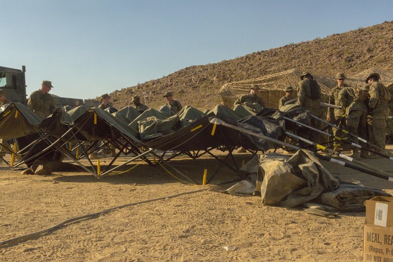 Marines with Combat Logistics Battalion 453, Combat Logistics Regiment 4, 4th Marine Logistics Group, MARFORRES, take down the forward battalion aid station during Integrated Training Exercise 4-17 in Twentynine Palms, California on June 23, 2017. The Marines disassembled and relocated the BAS to maintain close proximity with and provide rapid response to potential casualties of 2nd Battalion, 25th Marine Regiment, 4th Marine Division, MARFORRES, during the final battalion exercise of ITX 4-17.