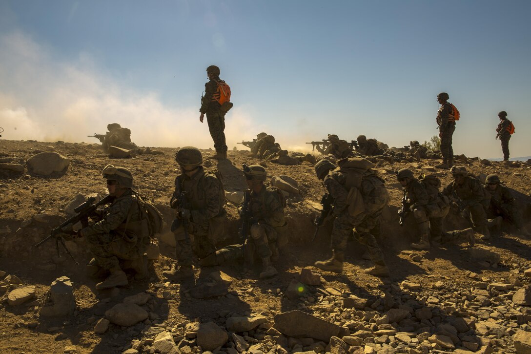 Marines with Echo Company, 2nd Battalion, 24th Marine Regiment, 4th Marine Division, Marine Forces Reserve prepare to move to their next objective during a live-fire exercise at Range 410A during Integrated Training Exercise 4-17 at Marine Corps Air Ground Combat Center, Twentynine Palms, California on June 26, 2017. ITX 4-17 is a combined arms exercise that trains Marines in such a way that they can seamlessly integrate with active duty Marines into a MAGTF.