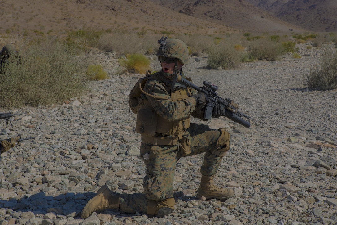 Cpl. John Johnson, a squad leader with Echo Company, 2nd Battalion, 24th Marine Regiment, 4th Marine Division, Marine Forces Reserve, calls out to his squad at range 410A at Marine Corps Air Ground Combat Center Twentynine Palms, California on June 26, 2017. The battalion conducted live-fire platoon attacks at the range during Integrated Training Exercise 4-17, which requires battalions and squadrons to integrate together as a cohesive team through shared planning, briefing, rehearsals, execution and debriefing.