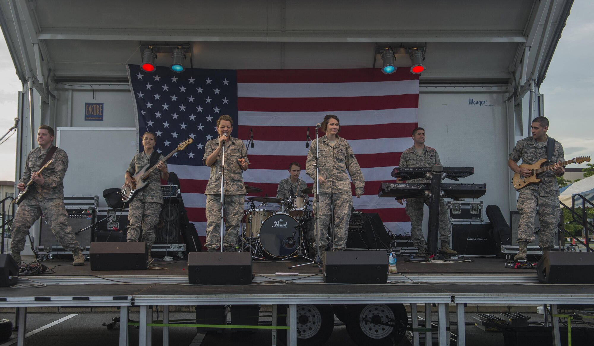Pacific Air Force Band members perform at the Celebrate America festival on Yokota Air Base, Japan, June 30, 2017. The festival brings a spice of traditional Indepence Day celebrations to service memebrs stationed at Yokota. (U.S. Air Force photo by Staff Sgt. David Owsianka)