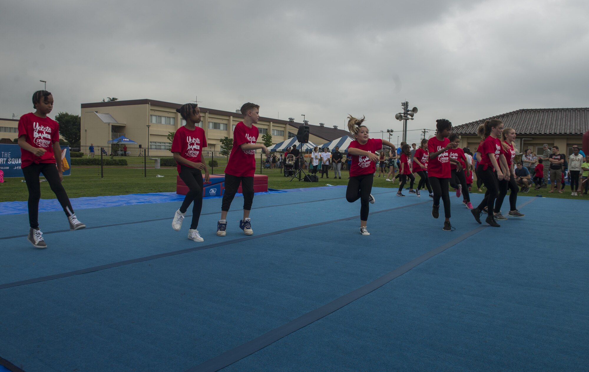 Children dance during a Yokota Dance Company performance at the Celebrate America festival on Yokota Air Base, Japan, June 30, 2017. The annual event provided military members and their families the opportunity to enjoy games, food and music culminating in a fireworks display over the Yokota Air Field to celebrate Independence Day.(U.S. Air Force photo by Staff Sgt. David Owsianka)