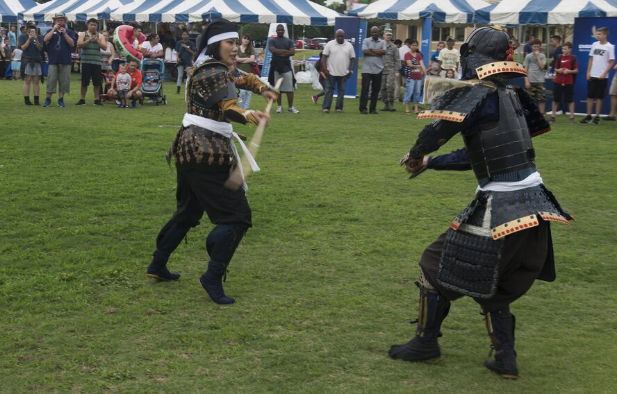 Japanese performers showcase a Samurai demonstration during the Celebrate America festival at Yokota Air Base, Japan, June 30, 2017. The day kicked off with the firecracker 5K run and a wide variety of activities to include a petting zoo, dance performaces, food and fireworks. (U.S. Air Force photo by Staff Sgt. David Owsianka)