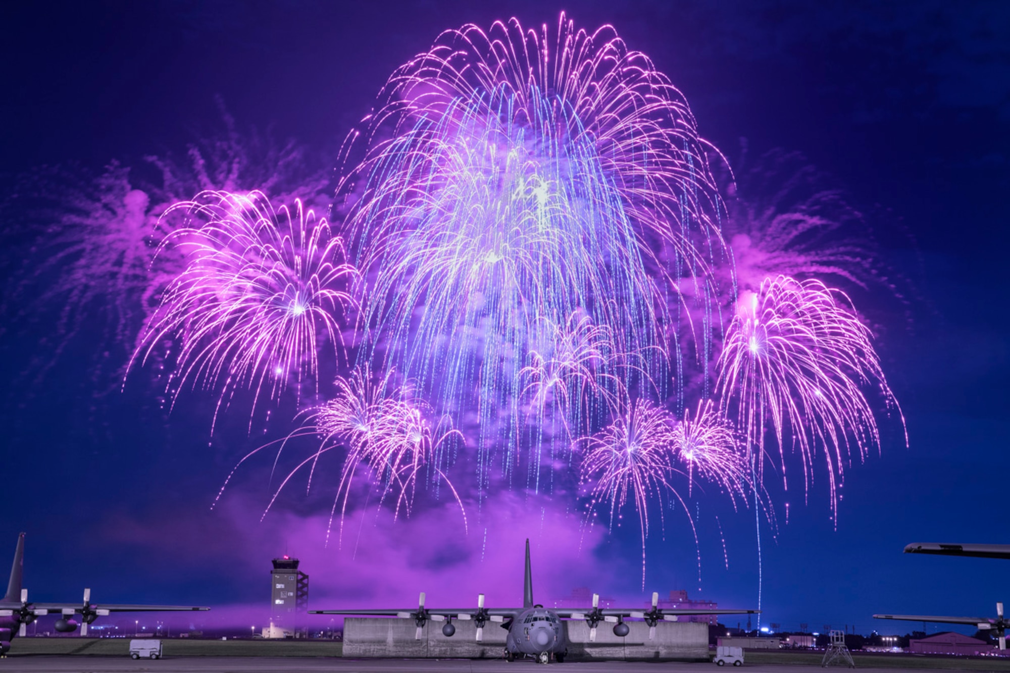 Fireworks explode behind C-130 Hercules during Celebrate America, June 30, 2017, at Yokota Air Base, Japan. Celebrate America is an annual event that provides military members and their families the opportunity to enjoy games, food and bands before culminating in a fireworks display over the Yokota airfield to celebrate Independence Day. (U.S. Air Force photo by Yasuo Osakabe)