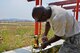 U.S. Air Force Senior Master Sgt. Deangelo Lee, 51st Operations Support Squadron Air Traffic Control Airfield Landing Systems superintendent, helps disassemble an instrument landing system at Osan Air Base, Republic of Korea, June 22, 2017. The ILS enables aircraft to make precision landings when a pilot is unable to establish visual contact with the runway. (U.S. Air Force photo by Airman 1st Class Gwendalyn Smith) 