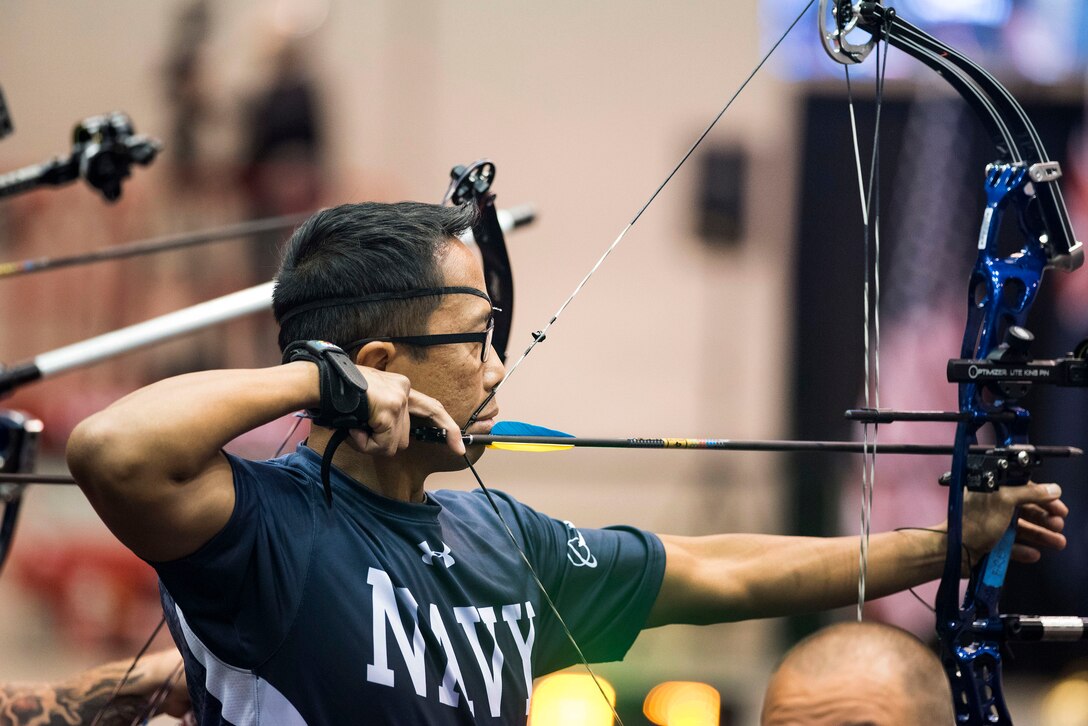 Navy Petty Officer 1st Class Romulo Urtula competes in archery during the 2017 Department of Defense Warrior Games in Chicago, July 3, 2017. DoD photo by Roger L. Wollenberg