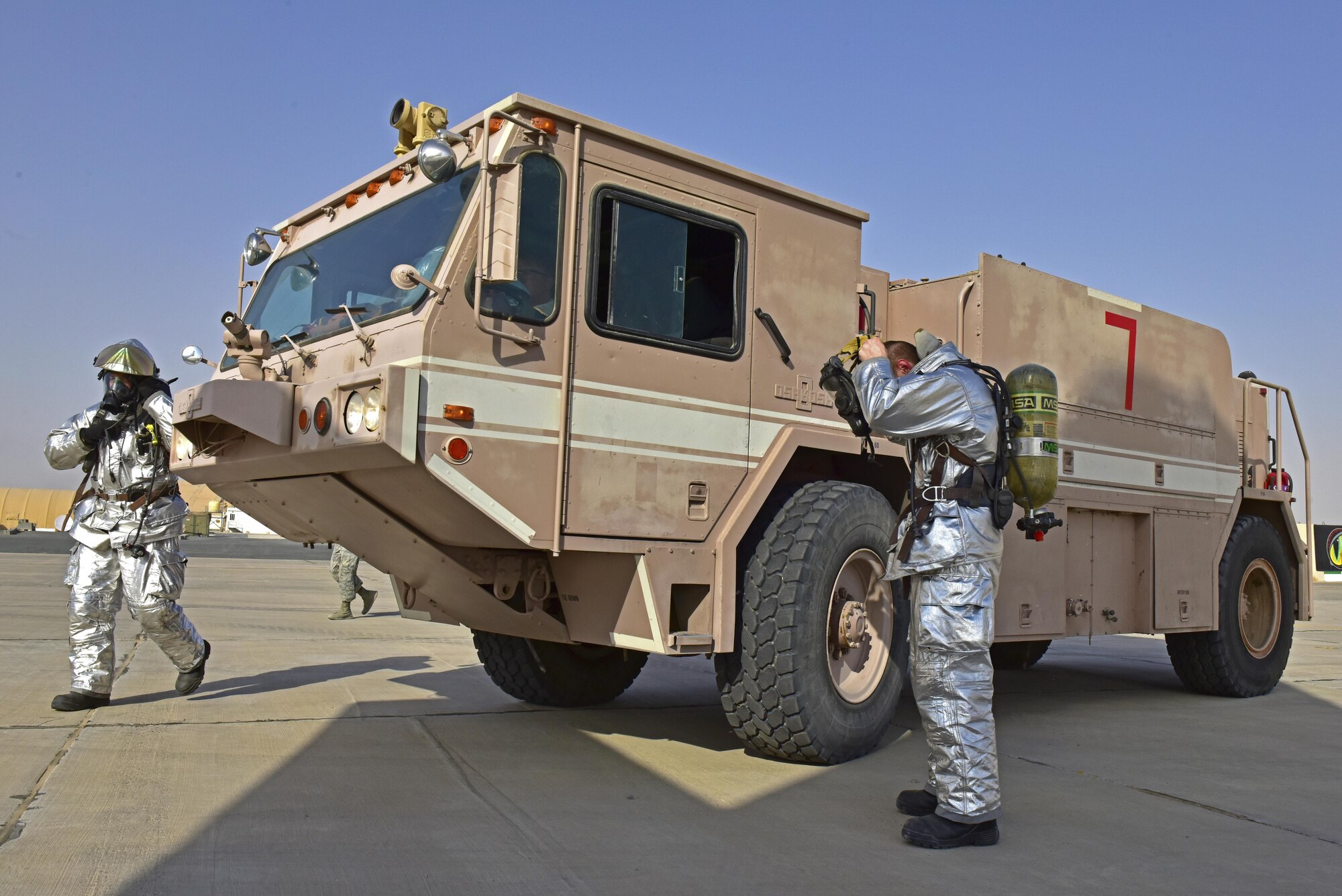 407th Expeditionary Civil Engineer Squadron fire department members prepare to enter a simulated mulfunctioned aircraft during a joint coalition exercise with U.S. Air Force  and Italian Air Force July 2, 2017, at the 407th Air Expeditionary Group in Southwest Asia. The exercise was a constructed as an in flight emergency, which the first responders task was to secure the area, determine safe for entry and then recover injured aircrew. (U.S. Air Force photo by Senior Airman Ramon A. Adelan)