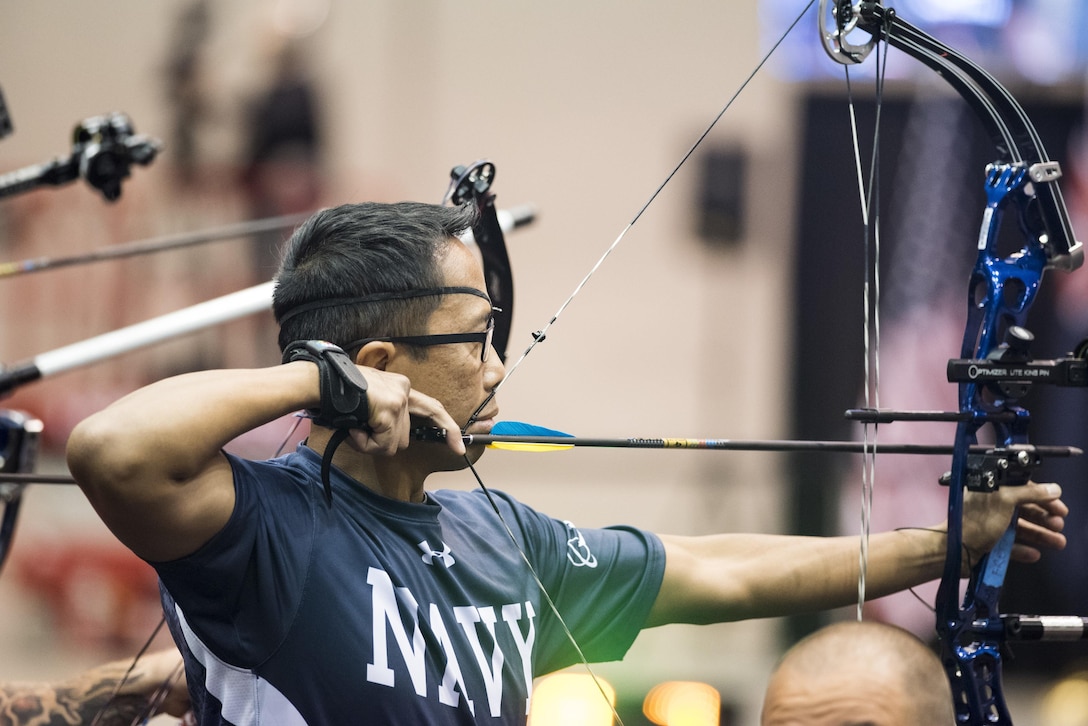 Navy Petty Officer 1st Class Romulo Urtula competes in archery during the 2017 Department of Defense Warrior Games at McCormick Place in Chicago, July 3, 2017. DoD photo by Roger L. Wollenberg