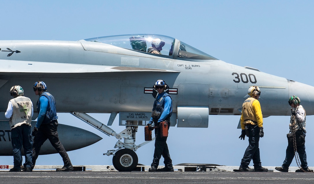 Sailors prepare for flight operations aboard the aircraft carrier USS George H.W. Bush in the Mediterranean Sea, June 26, 2017. Navy photo by Seaman Jennifer M. Kirkman