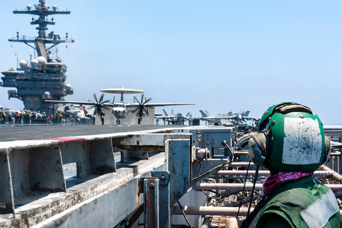 Navy Seaman James Johnson stands watch during flight operations aboard the aircraft carrier USS George H.W. Bush in the Mediterranean Sea, June 26, 2017. Johnson is an aviation boatswain's mate. Navy photo by Seaman Jennifer M. Kirkman