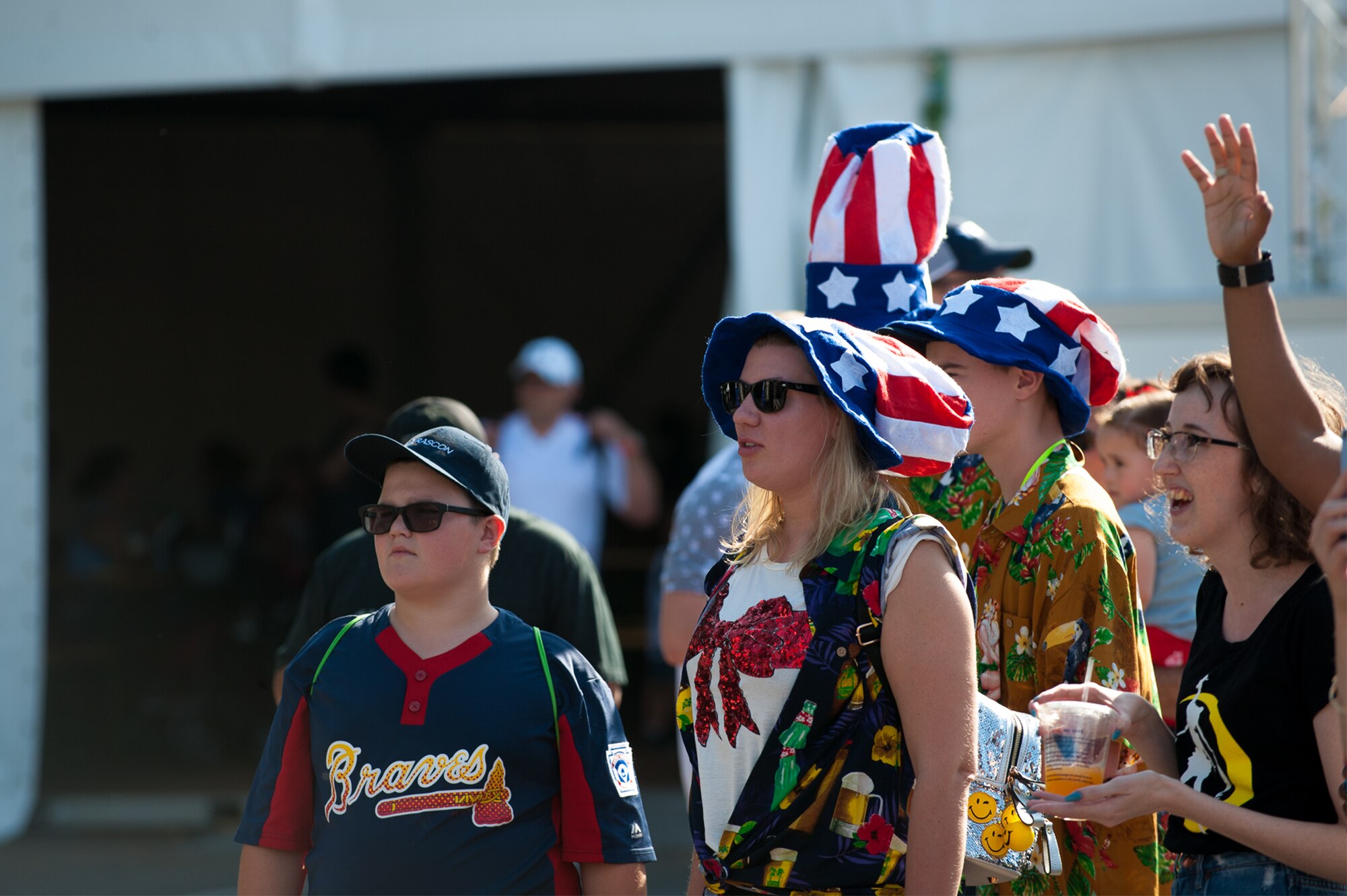 Kaiserslautern Military Community members listen to a band play during Freedom Fest at the Enlisted Club parking lot on Ramstein Air Base, Germany, July 4, 2017. KMC members wore American themed apparel to celebrate Independence Day, an American holiday commemorating the adoption of the Declaration of Independence. (U.S. Air Force photo by Senior Airman Devin Boyer)