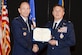 U.S. Air Force Gen. Mike Holmes, commander, Air Combat Command, presents retired Air Force Lt. Col. Gregory Thornton with the Silver Star medal certificate during a ceremony at the National Museum of the United States Air Force in Dayton, Ohio, June 30, 2017. Thornton received the Silver Star for his actions on April 6, 2003 while supporting ‘Advance 33,’ the call sign for a ground forward air controller attached to Task Force 2nd Battalion, 69th Armor, during combat operations in Iraq. The Silver Star is the third-highest combat decoration for gallantry in action that can be awarded to a member of the United States Armed Forces. (U.S. Air Force photo by Wesley Farnsworth) 