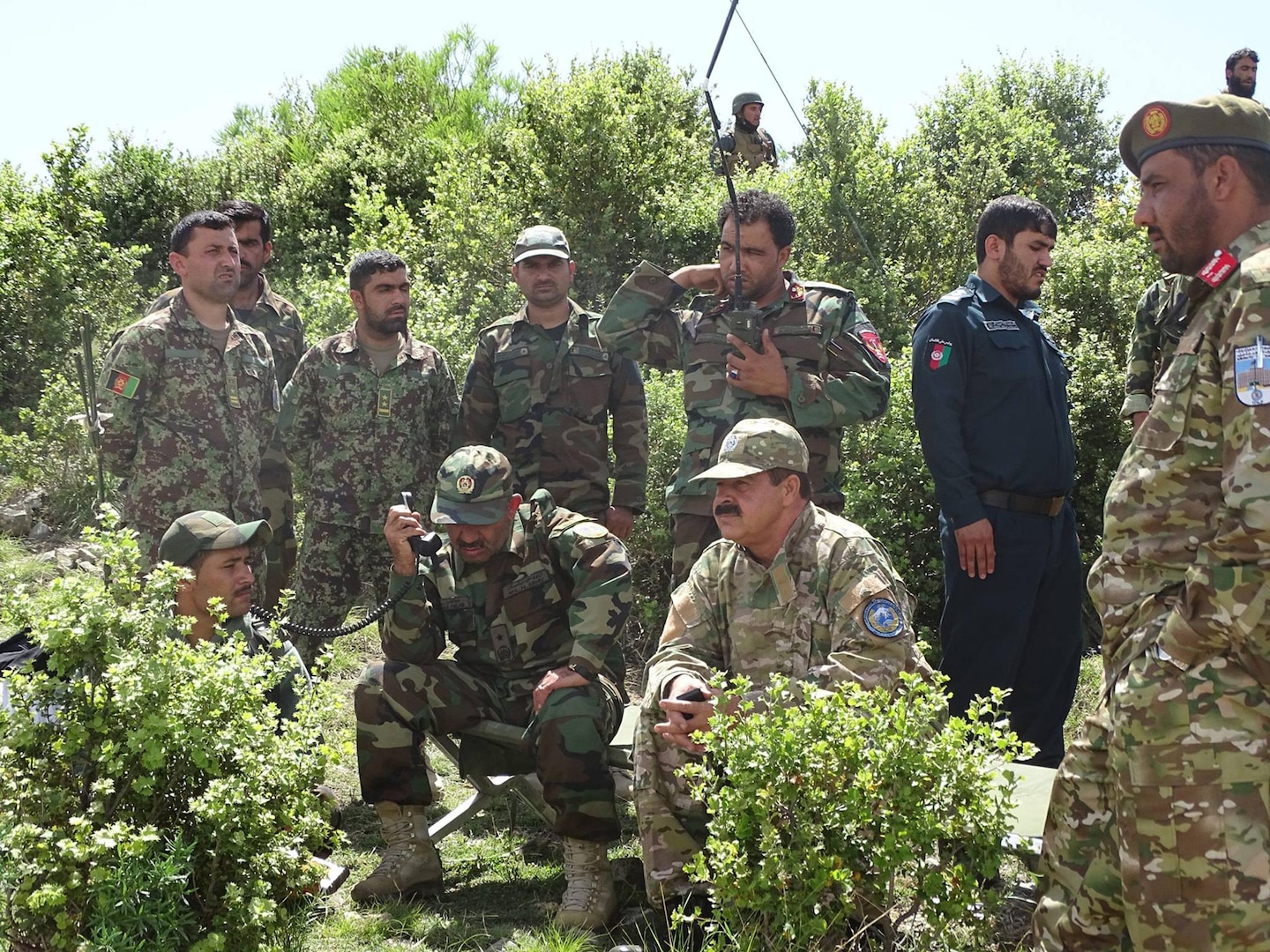 Brig. Gen. Abdul Wasea Milad,(Seated left) Commander of ANA 203rd “Thunder” Corps and Maj. Gen. Asadullah Shirzad, (Seated right) Commander of ANP 303rd Police Headquarters Zone  inspects operations May 21 in Dand-e-Patan district of southeastern Afghanistan during operations to secure routes through the Spin Ghar “White Mountain” range. (Afghanistan National Police photo provided by 303rd Police Zone PAO.)