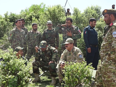 Brig. Gen. Abdul Wasea Milad,(Seated left) Commander of ANA 203rd “Thunder” Corps and Maj. Gen. Asadullah Shirzad, (Seated right) Commander of ANP 303rd Police Headquarters Zone  inspects operations May 21 in Dand-e-Patan district of southeastern Afghanistan during operations to secure routes through the Spin Ghar “White Mountain” range. (Afghanistan National Police photo provided by 303rd Police Zone PAO.)