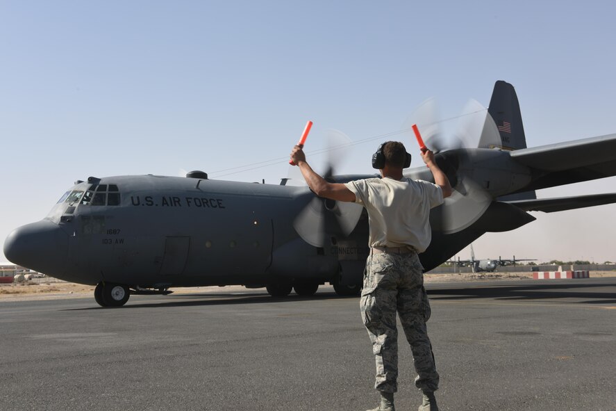 U.S. Air Force Academy Cadet Trey Griffin marshals a C-130 Hercules as it starts to taxi June 27, 2017, in Southwest Asia. The U.S. Air Force Academy cadets are deployed to the 386th Air Expeditionary Wing as part of the academy’s Operation Air Force program, which exposes cadets to a variety of career fields to aid them in their future career selections. (U.S. Air Force photo by Tech. Sgt. Jonathan Hehnly)