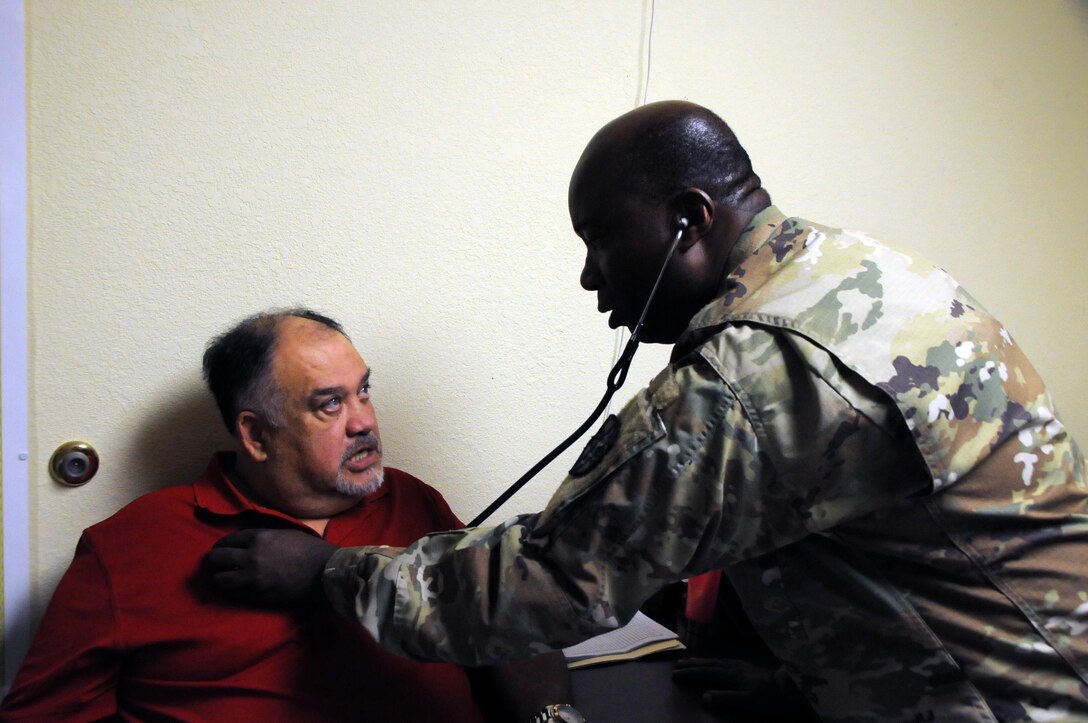 Lt. Col. Jude Momodu, a family physician and commander of 7229th Medical Support Unit located in Nashville, Tennessee, works with local residents at La Teresita community center.  Momodu is one of approximately 125 U.S. Army Reserve Soldiers who are working in partnership with the Texas A&M Colonias program to provide medical care to Webb County’s under-served Colonias population. Services provided by Army Reserve personnel are done through the Department of Defense’s Innovative Readiness Training, a civil-military program that builds mutually beneficial partnerships between U.S. communities and the DoD. The missions selected meet training & readiness requirements for Army Reserve service members while integrating them as a joint and whole-of-society team to serve our American citizens.