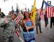 Capt. Elizabeth Wszalek, 932nd Airlift Wing executive officer during the week, and 932nd Force Support Squadron Manpower and Personnel Flight commander on drill weekends, joined up with many enthusiastic volunteers like Stephanie Smith and Master Sgt. Karen Ridge, along with other 932nd AW Airmen to celebrate America's Independence Day.  They walked and waved at crowds through the streets of Saint Louis as part of America's Birthday VP parade on July 1, 2017.   (U.S. Air Force photo by Lt. Col. Stan Paregien)