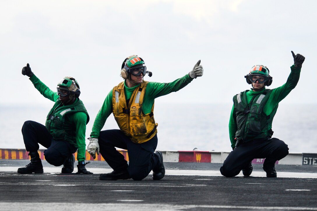 Sailors signal that an aircraft is ready to be launched from the flight deck of the aircraft carrier USS Nimitz in the Pacific Ocean, June 28, 2017. Navy photo by Petty Officer 2nd Class Holly L. Herline