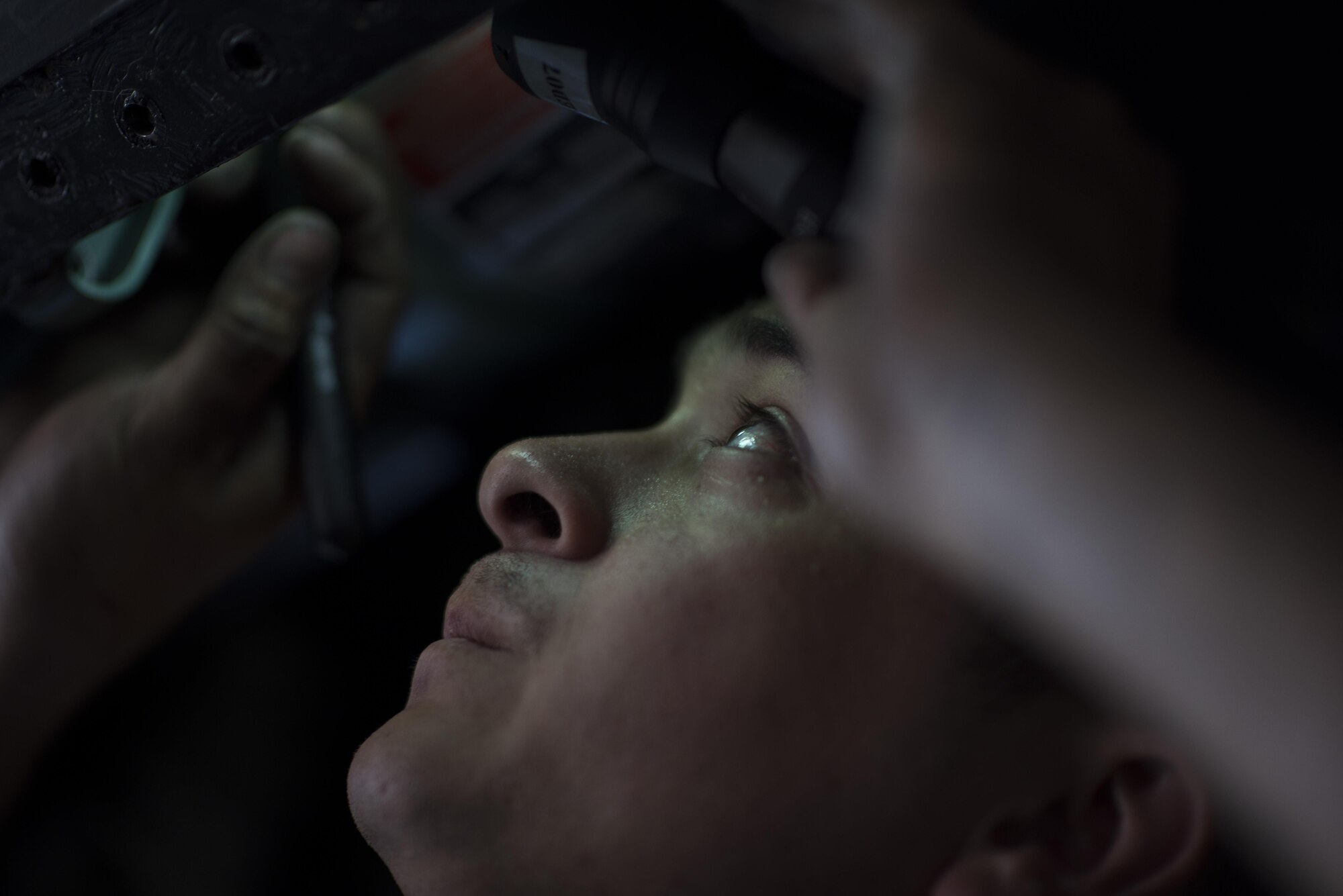 Staff Sgt. Maxwell Spates, 332nd Expeditionary Maintenance Squadron inspection section craftsman, inspects a jet fuel starter accumulator bay for damage and serviceability on an F-15E Strike Eagle, June 16, 2017, in Southwest Asia. Maintainers work throughout the day and night to ensure the pilots and F-15Es assigned to the 332nd Air Expeditionary Wing can continue their mission in support of Operation Inherent Resolve. (U.S. Air Force photo/Senior Airman Damon Kasberg)