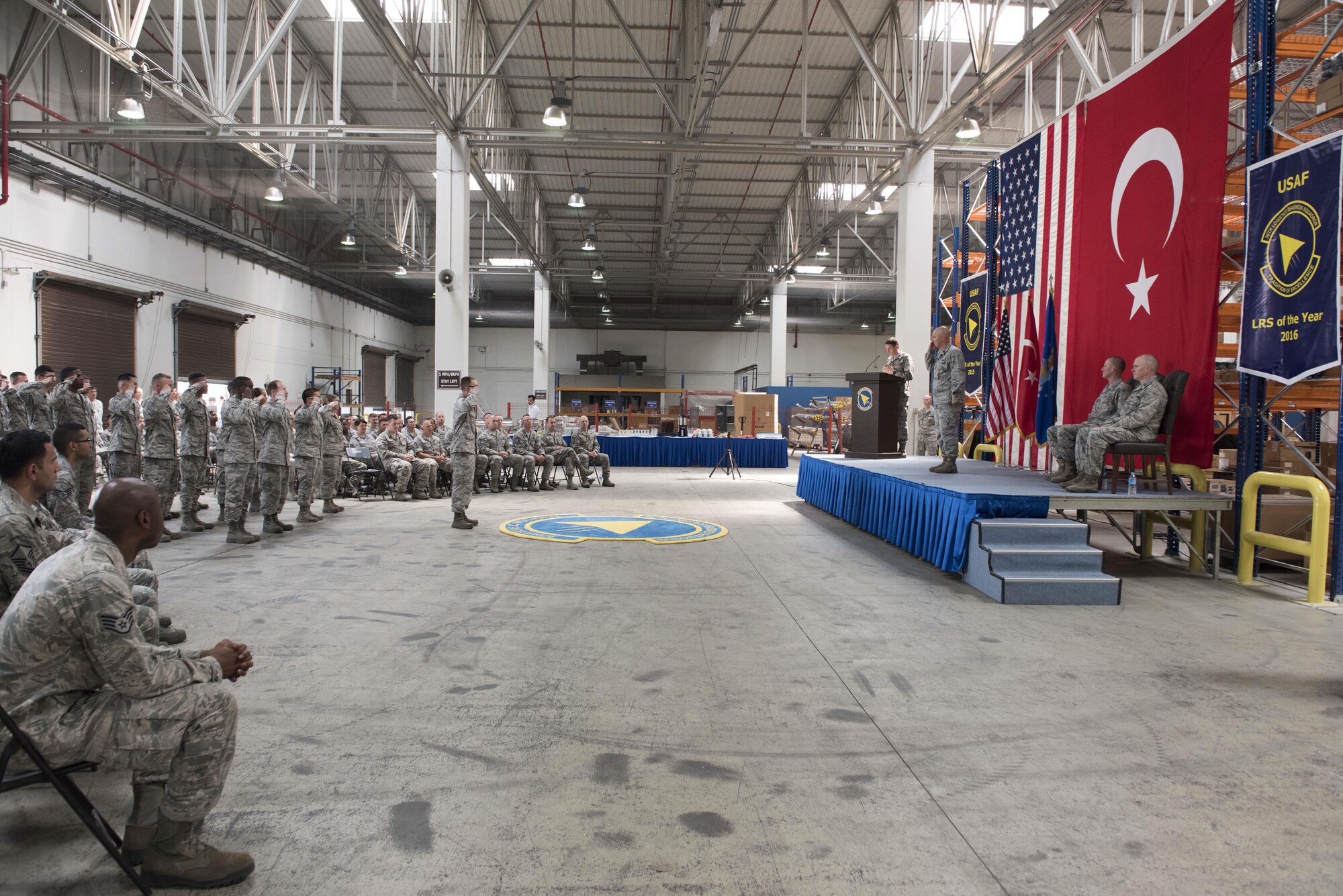 The 39th Logistics Readiness Squadron renders a final salute to Lt. Col. Phillip Wheeler, 39th Logistics Readiness Squadron commander June 29, 2017, at Incirlik Air Base, Turkey. Wheeler relinquished command to Maj. Matthew Shaw, incoming 39th LRS commander. (U.S. Air Force photo by Airman 1st Class Kristan Campbell)