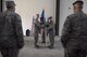 U.S. Air Force Col. James Zirkel, 39th Weapons System Security Group commander, left center, passes the guidon to Lt. Col. Christopher Sheffield, 39th Security Forces Squadron incoming commander, right center, June 26, 2017 at Incirlik Air Base, Turkey. The ceremony, rooted in military tradition, signified the transition of command. (U.S. Air Force photo by Airman 1st Class Kristan Campbell)