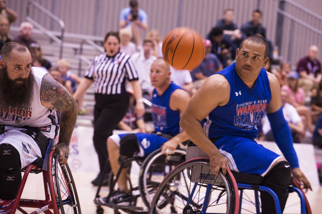 Air Force Tech. Sgt. Brian Williams tracks a loose basketball during the wheelchair basketball preliminary game during 2017 Department of Defense Warrior Games at McCormick Place-Lakeside Center in Chicago, June 30, 2017. Air Force photo by Staff Sgt. Keith James