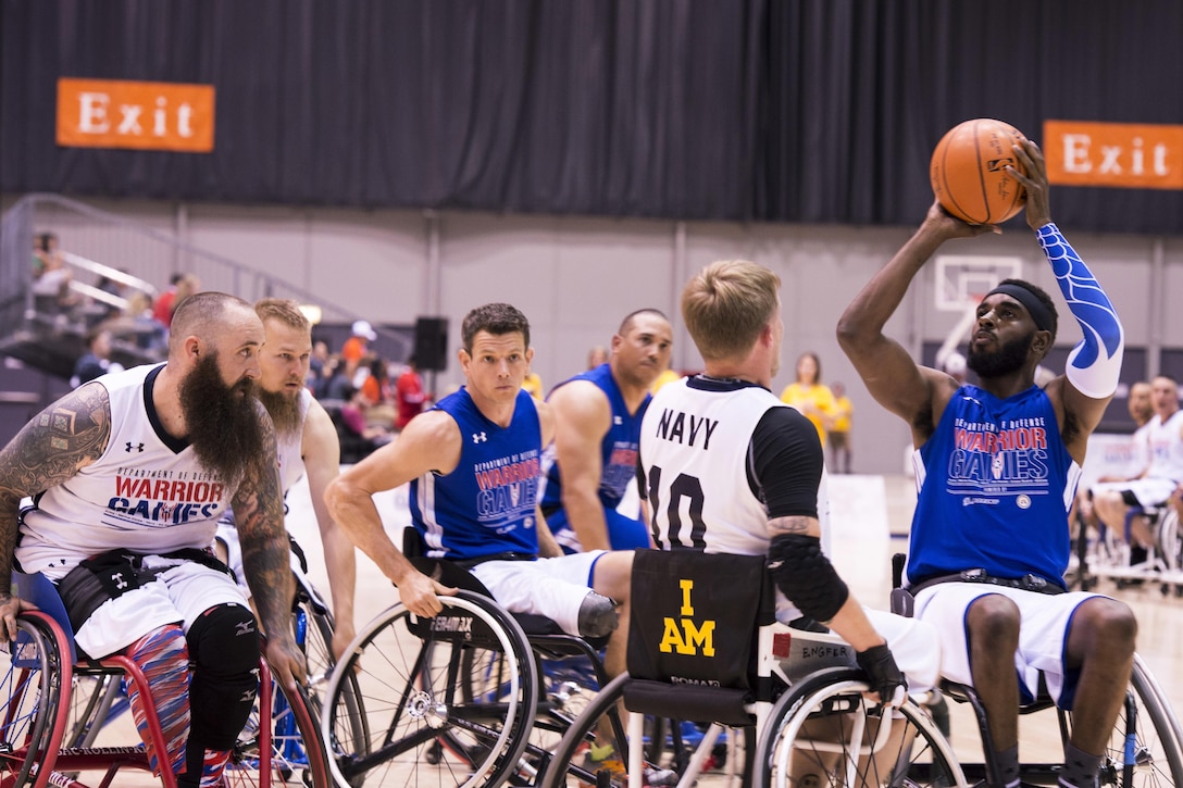 Air Force veteran Anthony Pearson, a former financial management and comptroller, sets up for a shot during a preliminary game of wheelchair basketball during 2017 Department of Defense Warrior Games at McCormick Place-Lakeside Center in Chicago, June 30, 2017. Air Force photo by Staff Sgt. Keith James