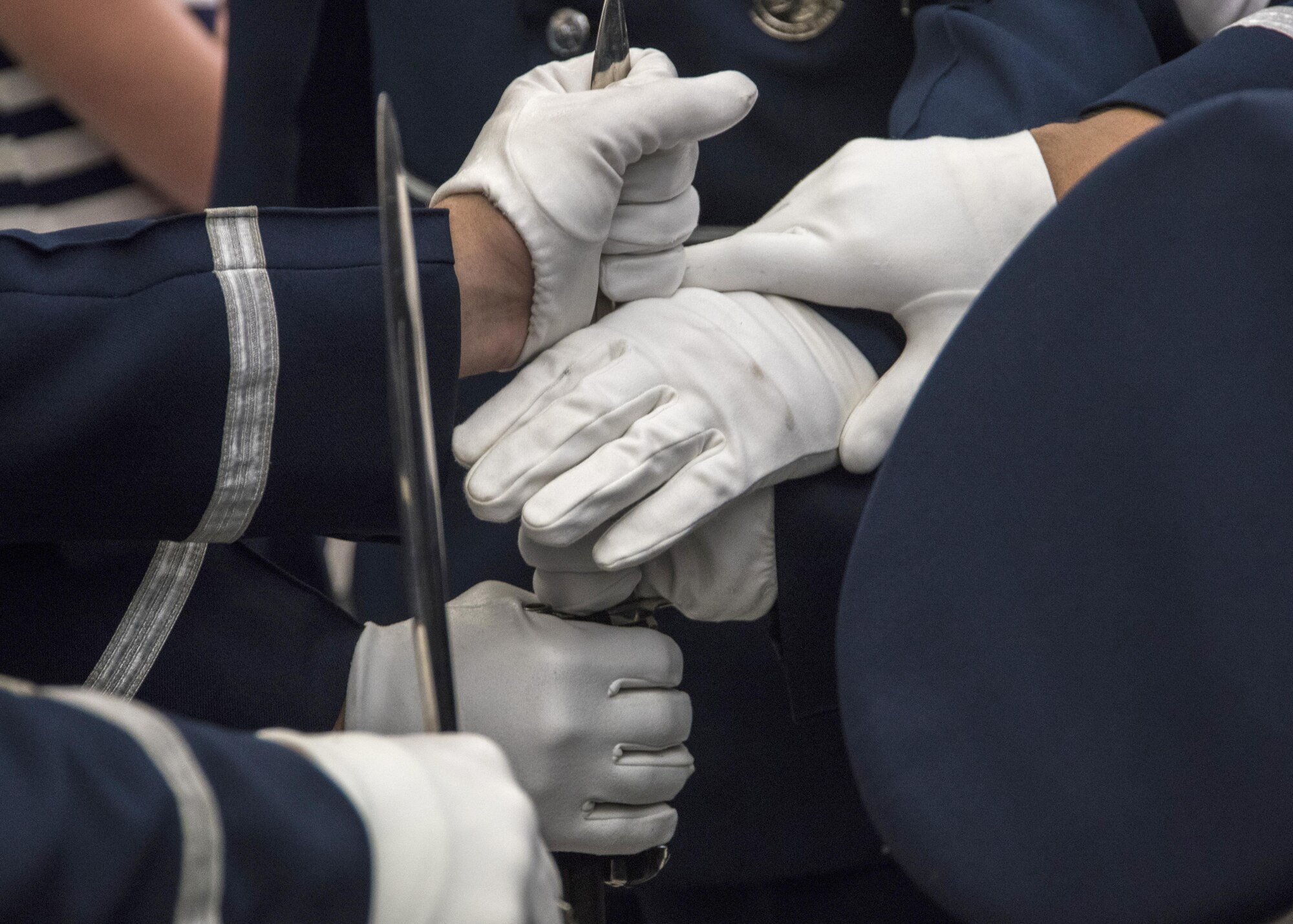 U.S. Air Force Honor Guard Drill Team members gather for a prayer prior to a performance at Sea World in San Diego, Ca., June 27, 2017. A standard drill team performance features a professionally choreographed sequence of weapon maneuvers. As Ambassadors in Blue, the drill team aims to recruit, retain, and inspire potential and current Airmen. (U.S. Air Force photo by Senior Airman Jordyn Fetter)