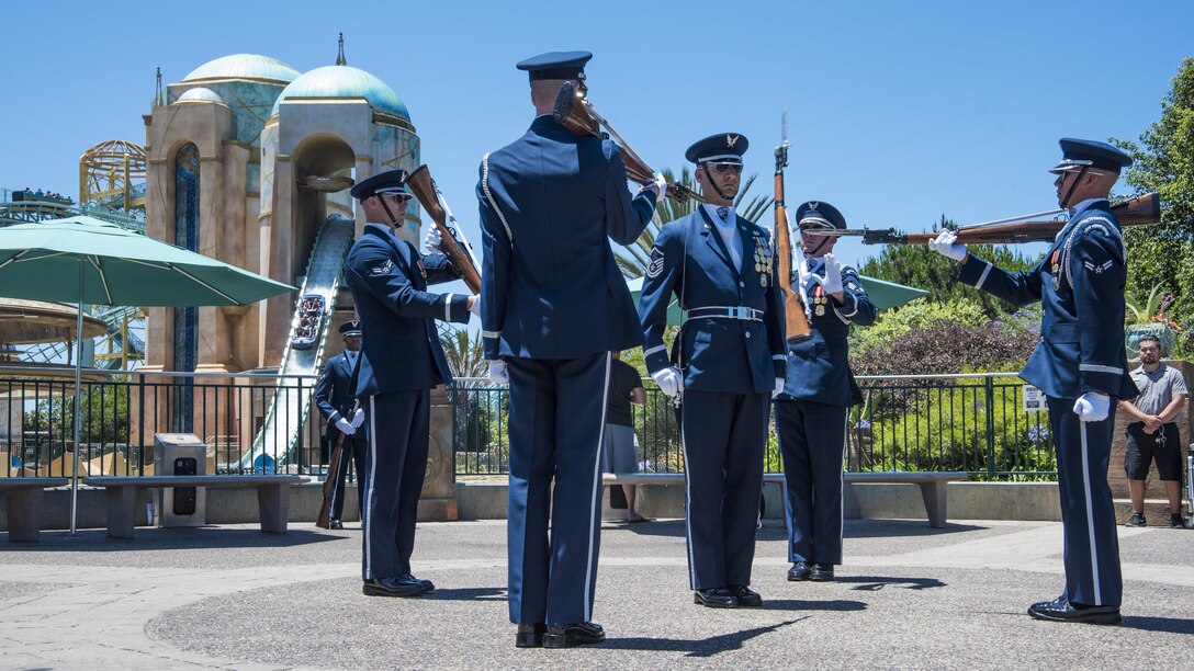 The U.S. Air Force Honor Guard Drill Team performs in front of the Sea World ride Atlantis in San Diego, Ca., June 27, 2017. The drill team promotes the Air Force mission worldwide by showcasing performances at public and military venues to recruit, retain, and inspire future and current Airmen. (U.S. Air Force photo by Senior Airman Jordyn Fetter)