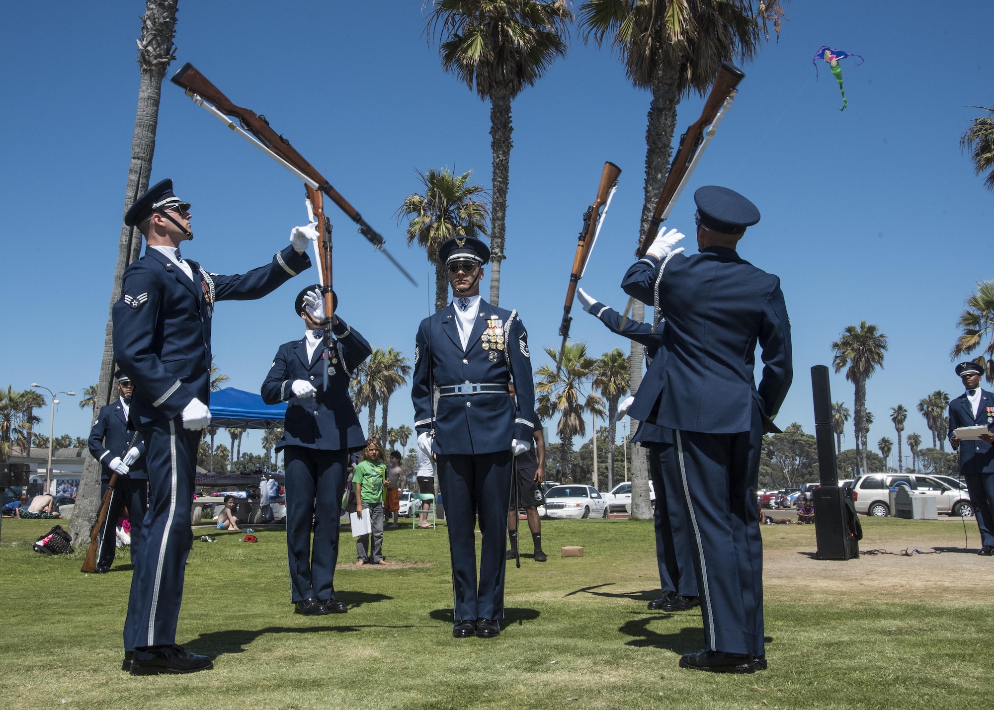 The U.S. Air Force Honor Guard performs a flash drill at Mission Beach, Ca., June 27, 2017. This impromptu performance of a routine drill is implemented to surprise the public with the team’s disciplined and coordinated military movements. The flash drill was the team’s second performance during their six-day trip throughout southern California. (U.S. Air Force photo by Senior Airman Jordyn Fetter)