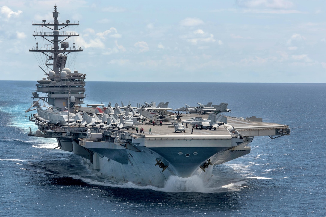 The aircraft carrier USS Ronald Reagan patrols the western Pacific Ocean, June 26, 2017. Reagan is the flagship of Carrier Strike Group 5, providing a combat-ready force that protects and defends the collective maritime interests of its allies and partners in the Indo-Asia-Pacific region. Navy photo by Petty Officer 2nd Class Nathan Burke