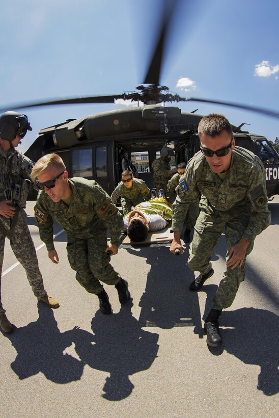 Members of the Kosovo Security Force and Army soldiers, assigned to Multinational Battle Group-East’s Southern Command Post, transport a casualty during medevac training in Pristina, Kosovo, June 28, 2017. The KSF practiced off-loading and treating patients alongside the newest rotation of MNBG-East’s SCP flight medics, who will continue training with the KSF. Army photo by Spc. Adeline Witherspoon