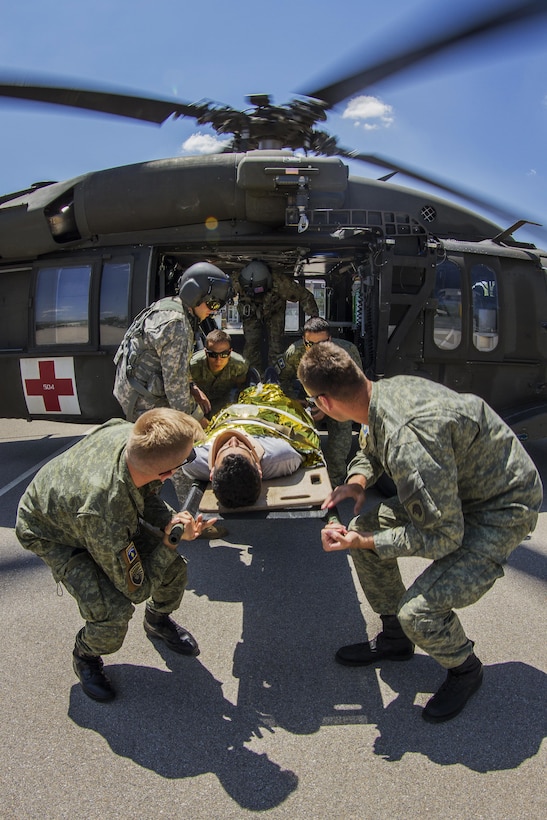 Members of the Kosovo Security Force and Army soldiers, assigned to Multinational Battle Group-East’s Southern Command Post, transport a casualty during medevac training in Pristina, Kosovo, June 28, 2017. Army photo by Spc. Adeline Witherspoon