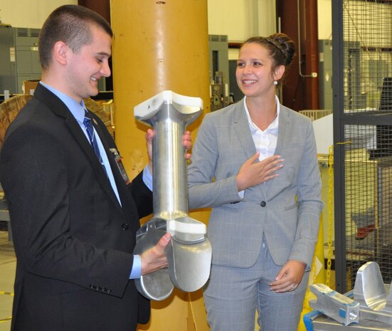 DAHLGREN, Va. (June 13, 2017) - A Science, Mathematics & Research for Transformation (SMART) Scholar holds a railgun test article during a briefing of the U.S. Navy's electromagnetic railgun prototype launcher. The Missile Defense Agency sponsored the college students who are among those pursuing a degree in, or closely related to, science, technology, engineering, and mathematics disciplines through the Department of Defense SMART Scholar program. Students selected for SMART Scholarships are offered internships and opportunities to pursue civilian careers in the federal government.