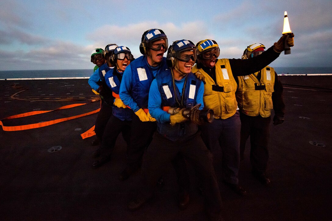 Sailors relay procedures during a phase 3 firefighting drill aboard the aircraft carrier USS Theodore Roosevelt in the Pacific Ocean, June 27, 2017. Navy photo by Petty Officer 3rd Class Anthony J. Rivera