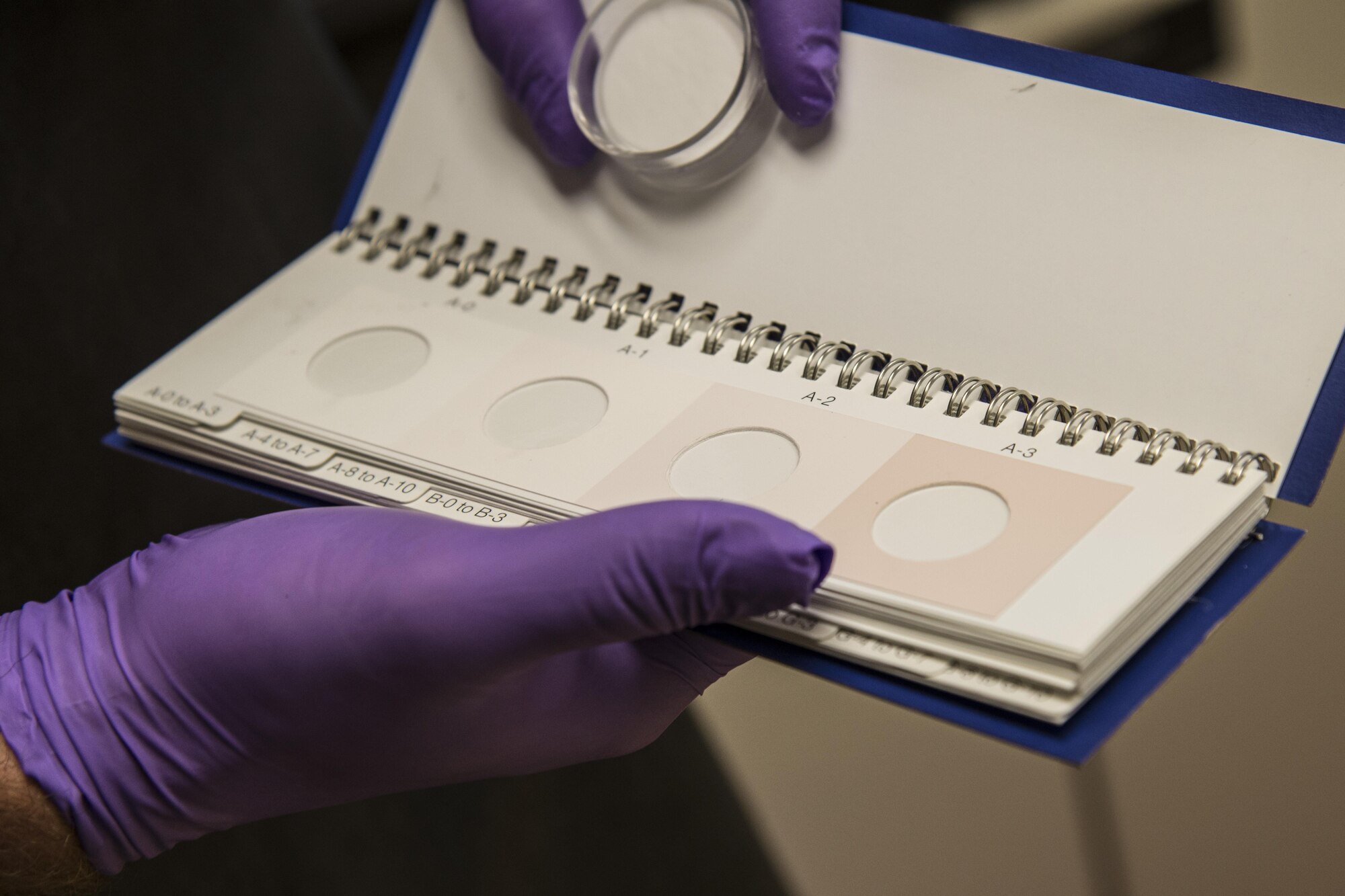 Senior Airman Ian Elder, 375th Logistics Readiness Squadron fuels laboratory technician, tests for particulates in a fuel sample June 14, 2017, Scott Air Force Base, Ill. The testing lab at the Fuels Management Flight performs constant testing of the quality of fuel that is shipped to Scott. (U.S. Air Force photo by Senior Airman Melissa Estevez)