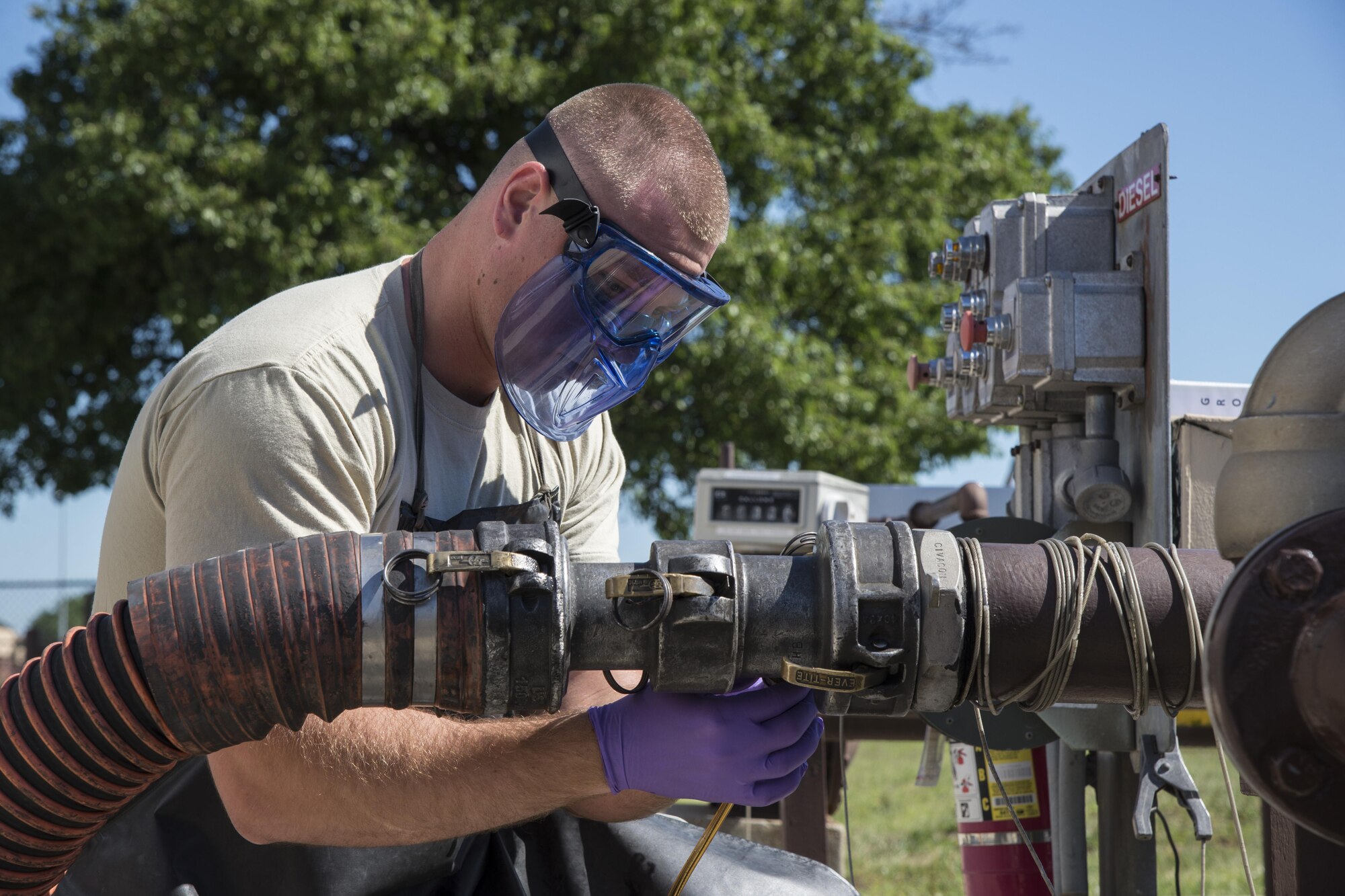Senior Airman Ian Elder, 375th Logistics Readiness Squadron fuels laboratory technician, pulls a sample from a fuel truck June 14, 2017, Scott Air Force Base, Ill. The 375th LRS receives, stores and issues petroleum products purchased for use in Air Force vehicles, aircraft and support equipment. (U.S. Air Force photo by Senior Airman Melissa Estevez)