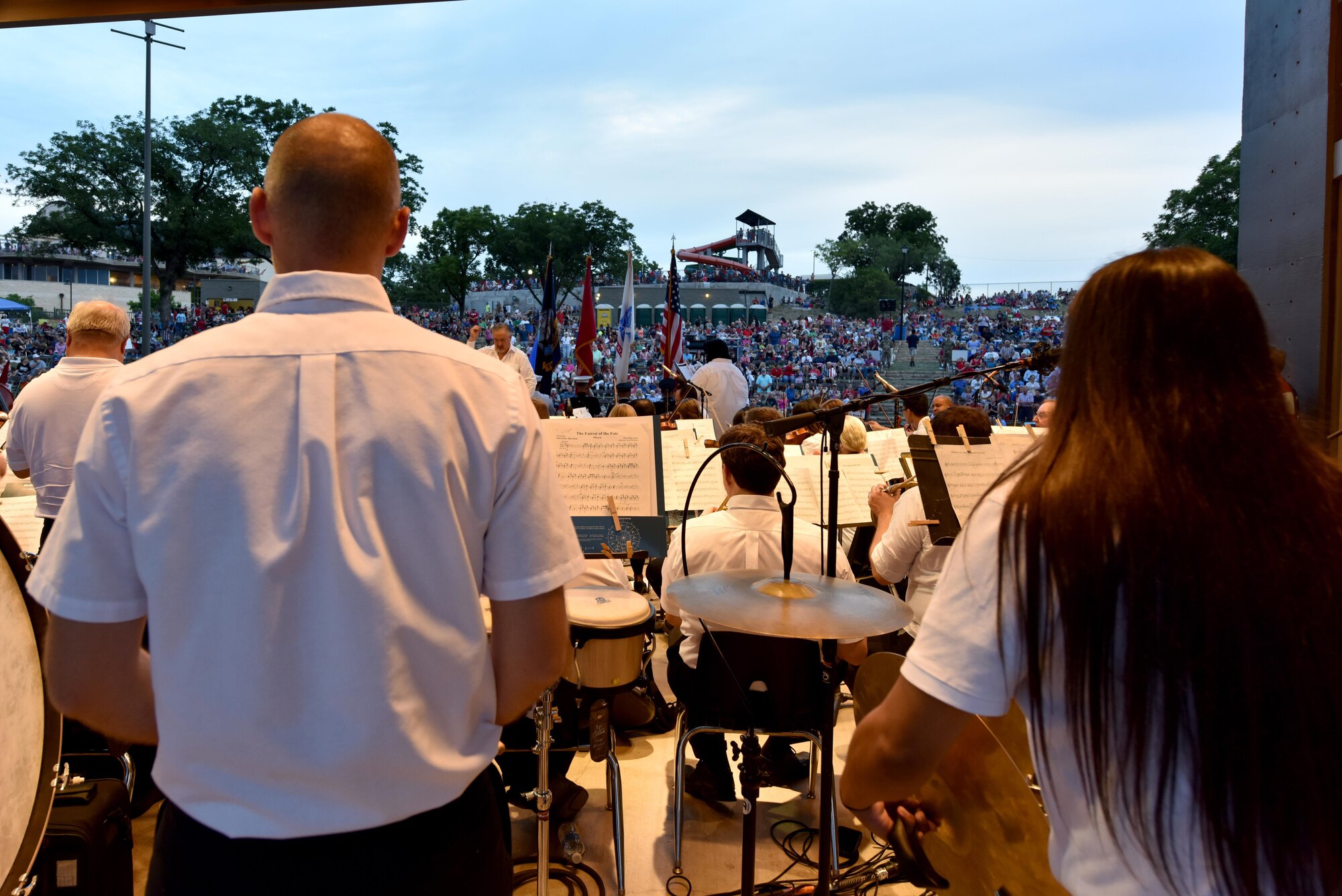 The San Angelo Symphony plays “A Salute to the Armed Forces” during the 30th Annual San Angelo Symphony’s Pops Concert at the Bill Aylor Sr. Memorial RiverStage in San Angelo, Texas, July 3, 2017. During the song, the Goodfellow Air Force Base Honor Guard presented the service flags that corresponded with the song. (U.S. Air Force photo by Staff Sgt. Joshua Edwards/Released)