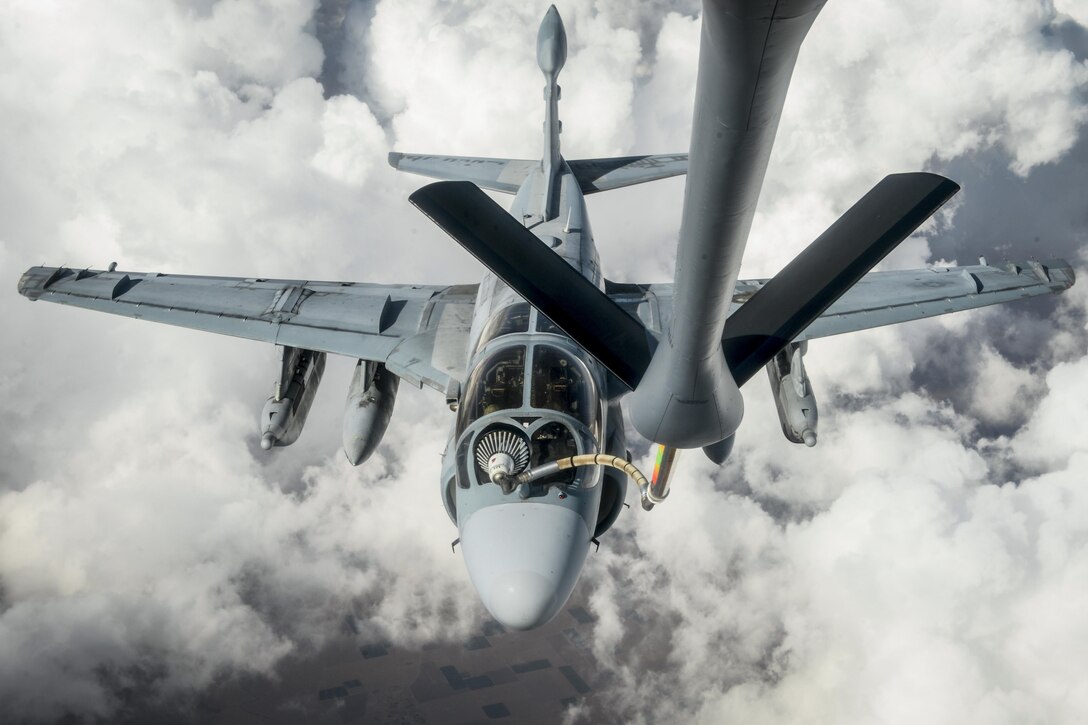 A Marine Corps EA-6B Prowler receives fuel from an Air Force KC-135 Stratotanker in an undisclosed location, July 1, 2017, while supporting Operation Inherent Resolve. Air Force photo by Staff Sgt. Michael Battles