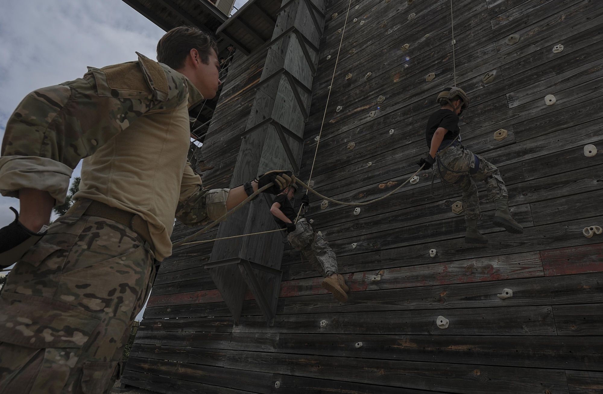 A Special Tactics Airman with the 23rd Special Tactics Squadron belays Junior ROTC cadets during Summer Leadership School at Hurlburt Field, Fla., June 28, 2017. Special Tactics Airmen partnered with more than 50 cadets from five local high schools for a week-long Summer Leadership Course to learn leadership, teamwork, and self-confidence. (U.S. Air Force photo by Airman 1st Class Rachel Yates) 