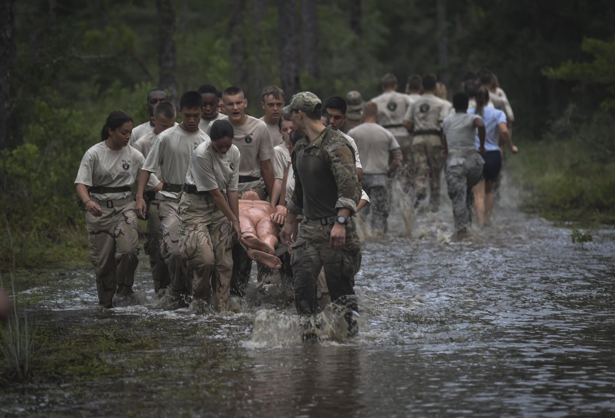 Junior ROTC cadets litter carry a simulated patient during a Monster Mash at Hurlburt Field, Fla., June 30, 2017. Monster Mash is a long-standing Special Tactics training tradition, an event where special operators will complete timed scenarios at different stations of core mission training. (U.S. Air Force photo by Senior Airman Ryan Conroy)