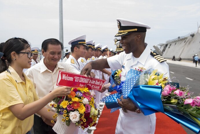 Commodore, Destroyer Squadron 7 Capt. Lex Walker is greeted by senior Vietnam People’s Navy officials during the opening ceremony for Naval Engagement Activity (NEA) Vietnam 2017 at Cam Ranh International Port, July 5. The engagement provides an opportunity for Sailors from the U.S. and Vietnam People's Navy to interact and share knowledge to enhance mutual capabilities and strengthen solid partnerships. 