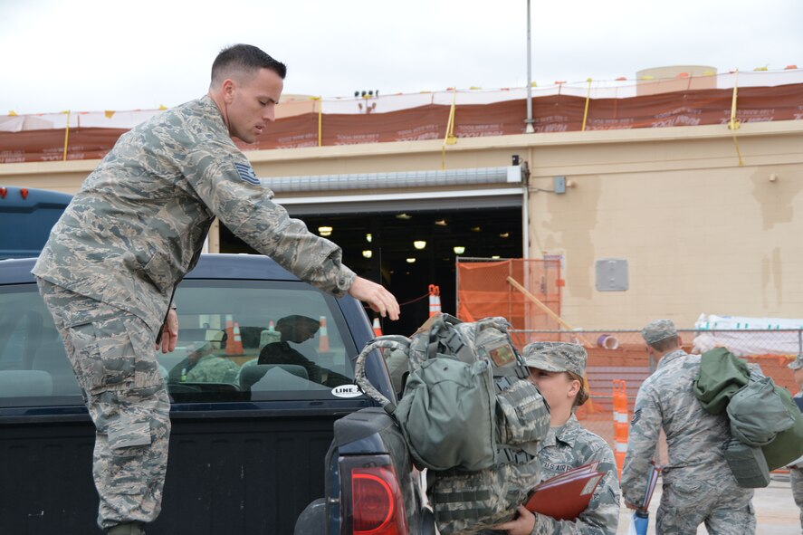 Citizen Airmen move bags for pre-deployment processing through the personnel deployment function line March 25, 2017, at Tinker Air Force Base, Okla. (U.S. Air Force photo/Senior Airman Callie McNary) 